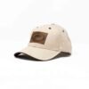 Tan hat with leather logo.
